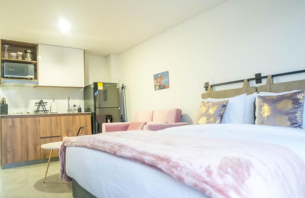 Ένα ή περισσότερα κρεβάτια σε δωμάτιο στο Loft moderno en Armenia con ubicación privilegiada 7