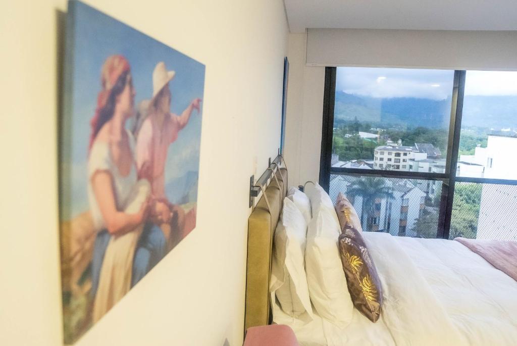 Ένα ή περισσότερα κρεβάτια σε δωμάτιο στο Loft moderno en Armenia con ubicación privilegiada 7