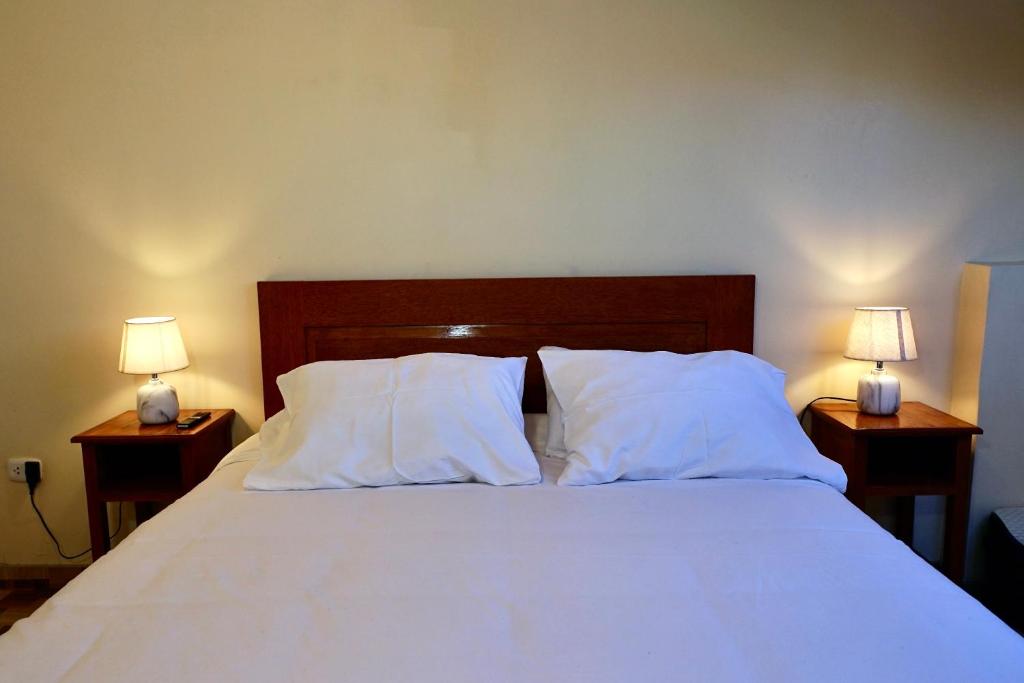 Postel nebo postele na pokoji v ubytování Casa Medina Hostal
