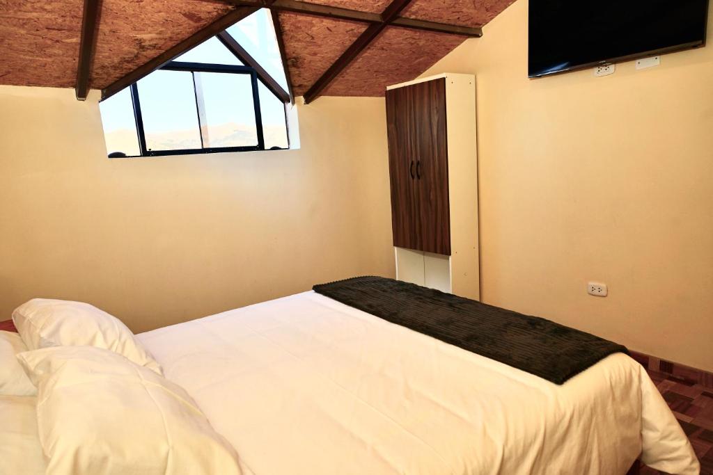 Postel nebo postele na pokoji v ubytování Casa Medina Hostal