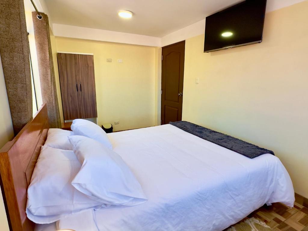 Postel nebo postele na pokoji v ubytování Casa Medina Hostal
