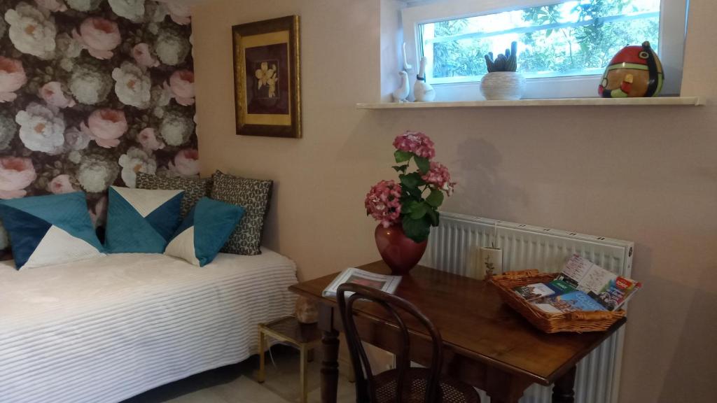 Postel nebo postele na pokoji v ubytování Les Hortensias