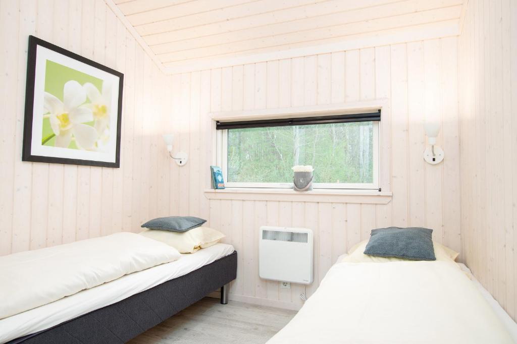 Postel nebo postele na pokoji v ubytování Resort 2 Ferienhaus Typ D 28