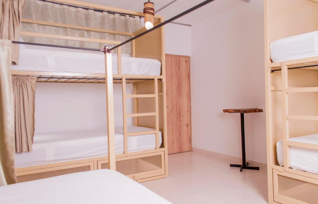 Postel nebo postele na pokoji v ubytování Hostal Las Guaduas