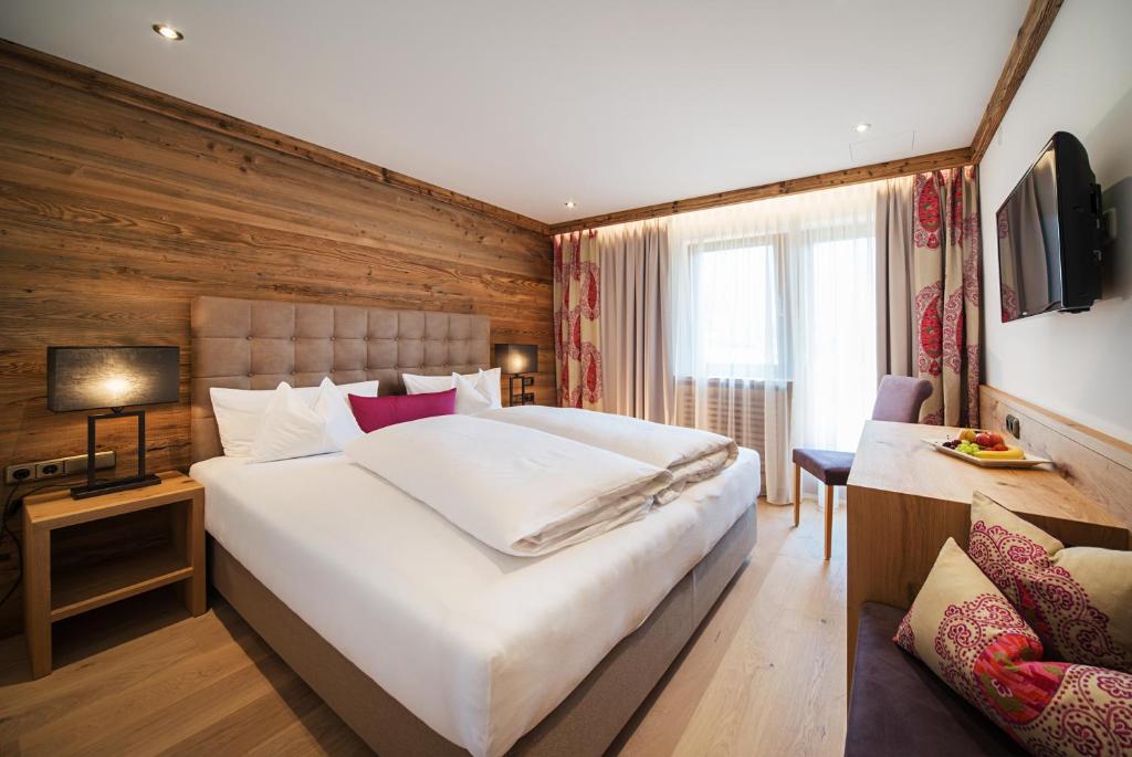 Postel nebo postele na pokoji v ubytování Hotel Garni Glockenstuhl
