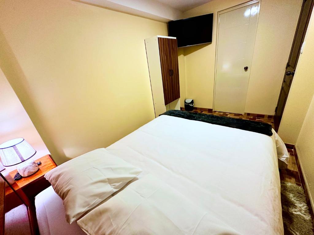 Postel nebo postele na pokoji v ubytování Casa Medina Hostal