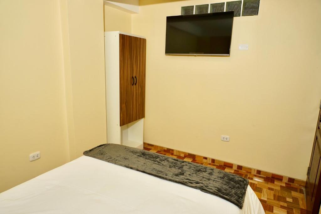 Postel nebo postele na pokoji v ubytování Casa Medina Hostal