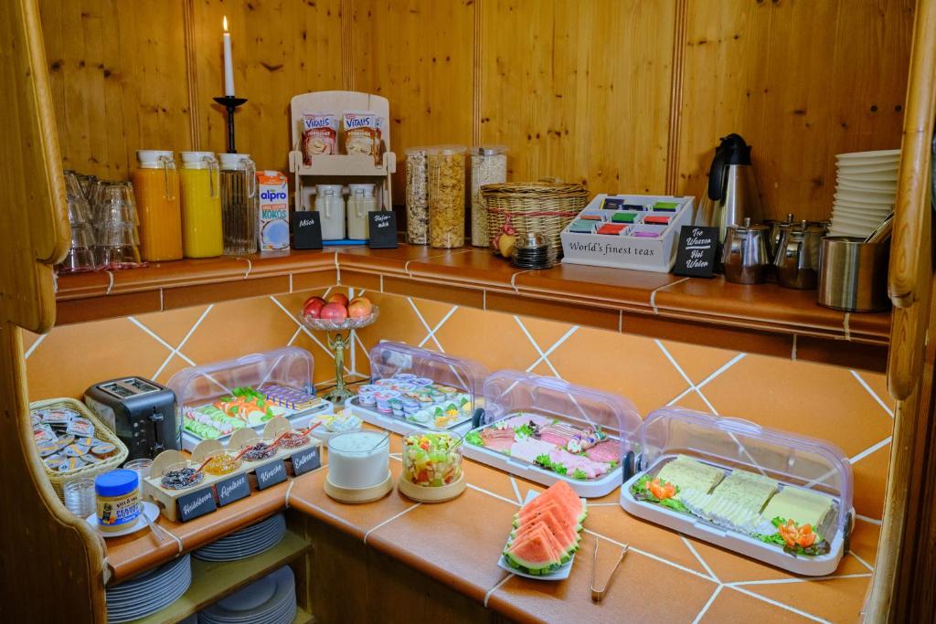 a kitchen with some food on a shelf at Anno 1900 Hotel Babelsberg in Potsdam