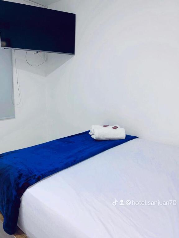 Postel nebo postele na pokoji v ubytování Hotel San Juan 70 Express Medellin