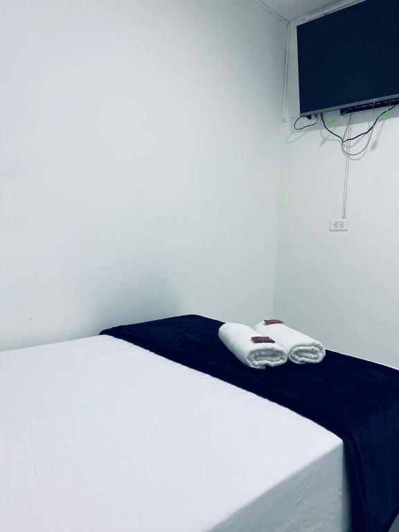 Postel nebo postele na pokoji v ubytování Hotel San Juan 70 Express Medellin