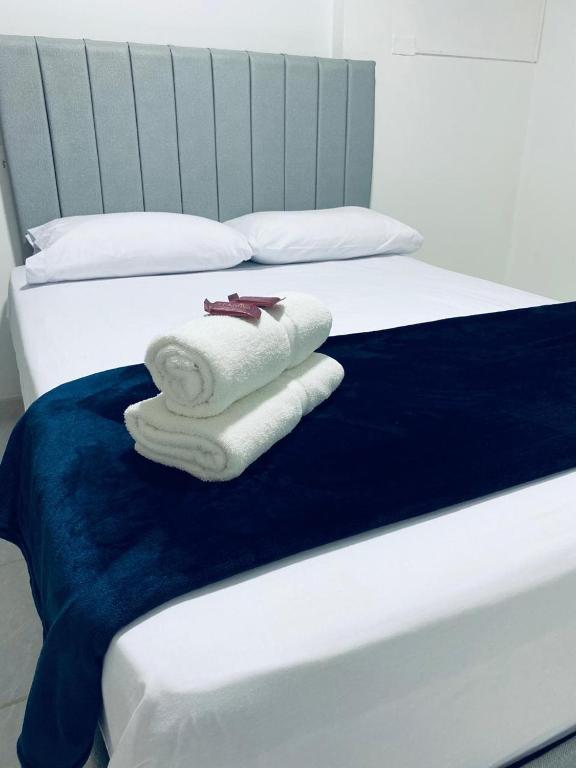 Postel nebo postele na pokoji v ubytování Hotel San Juan 70 Express Medellin