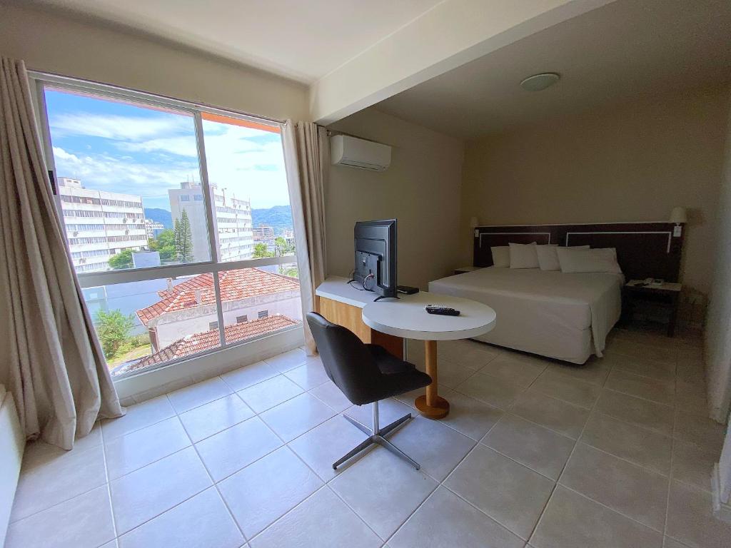 Postel nebo postele na pokoji v ubytování Altadomo Hotel