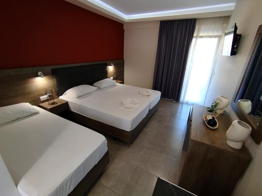 Postel nebo postele na pokoji v ubytování AEGEAN BLUE Apartments & Suites