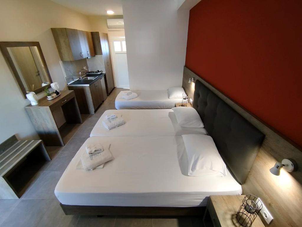 Kuchyň nebo kuchyňský kout v ubytování AEGEAN BLUE Apartments & Suites