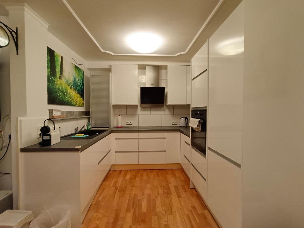 Kuchyň nebo kuchyňský kout v ubytování Suite-Traunsee