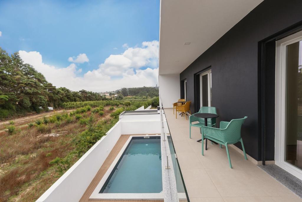 a swimming pool on the balcony of a house at Casa Branca in Óbidos