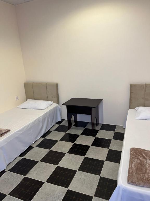 Postel nebo postele na pokoji v ubytování Tagalradia Hostel