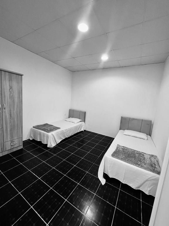 Postel nebo postele na pokoji v ubytování Tagalradia Hostel