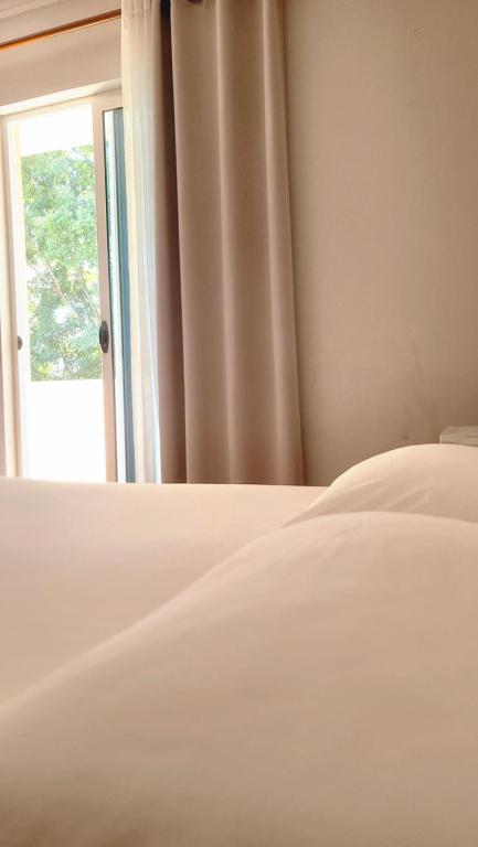 Postel nebo postele na pokoji v ubytování Hotel Ceka