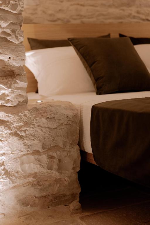 Postel nebo postele na pokoji v ubytování Trullo Amiura B&B