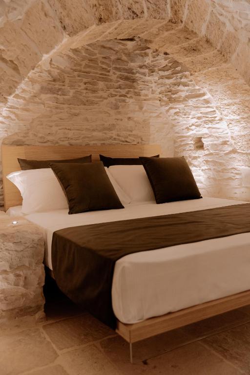 Postel nebo postele na pokoji v ubytování Trullo Amiura B&B