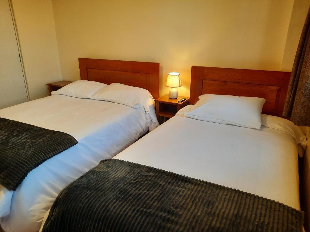 Postel nebo postele na pokoji v ubytování Casa Medina Hostal
