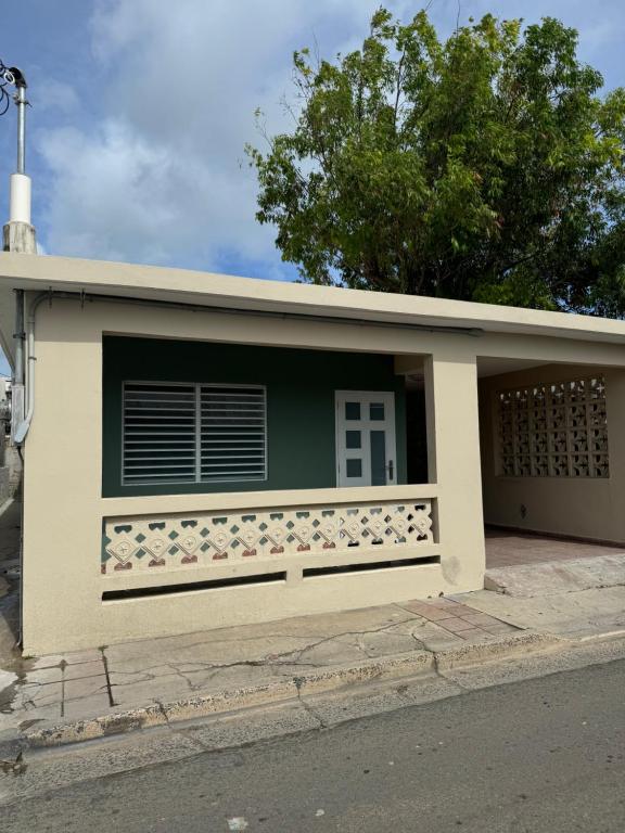 a building with a window and a fence at Casa Morales in Vieques