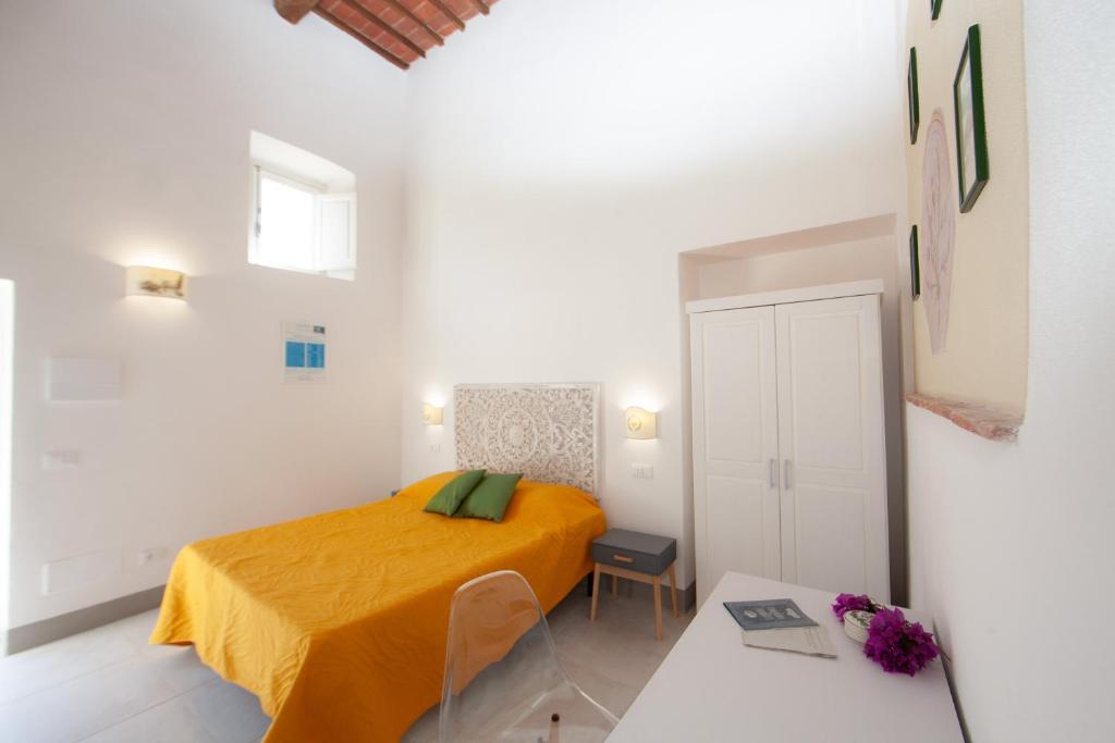 Una cama o camas en una habitación de Villa le Api