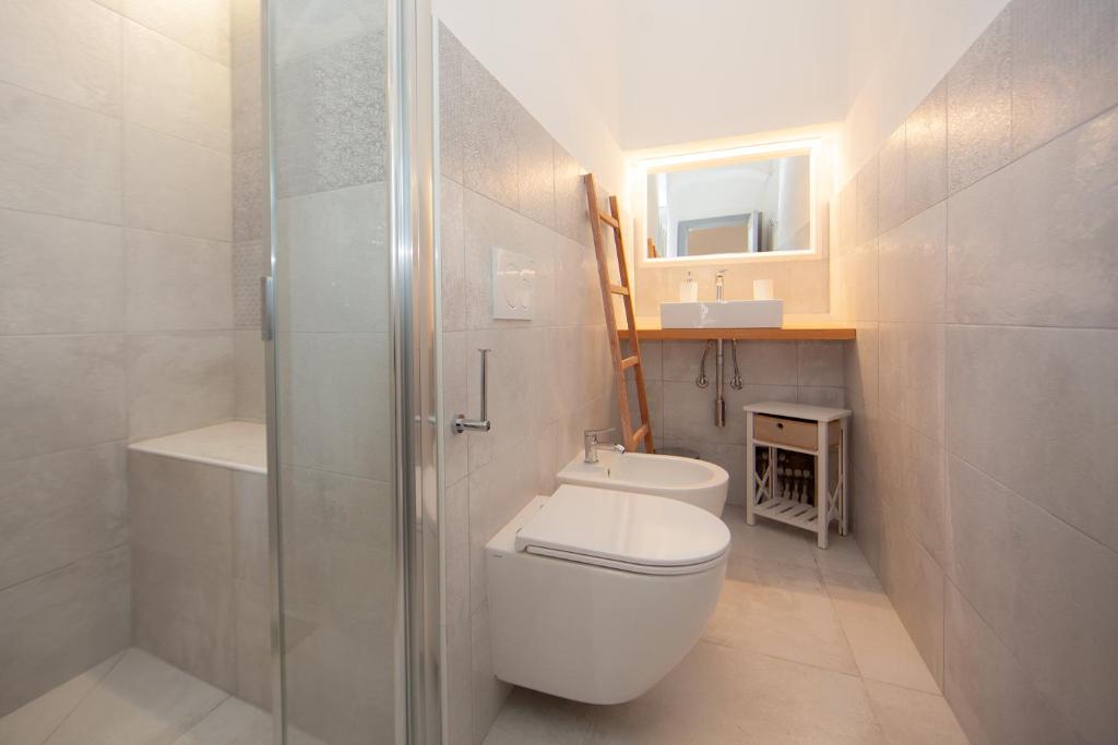 Un baño de Villa le Api