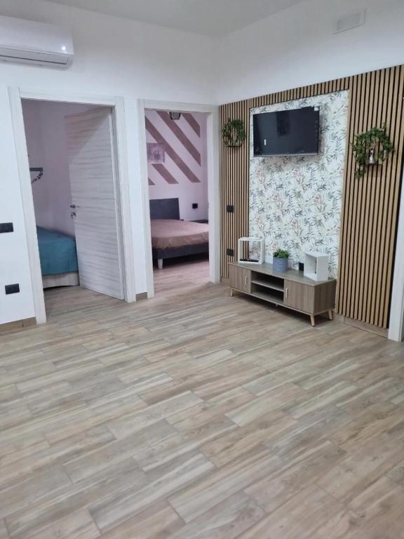 TV a/nebo společenská místnost v ubytování Vida Loca -Appartamento vicino aereporto e 200mt spiaggia