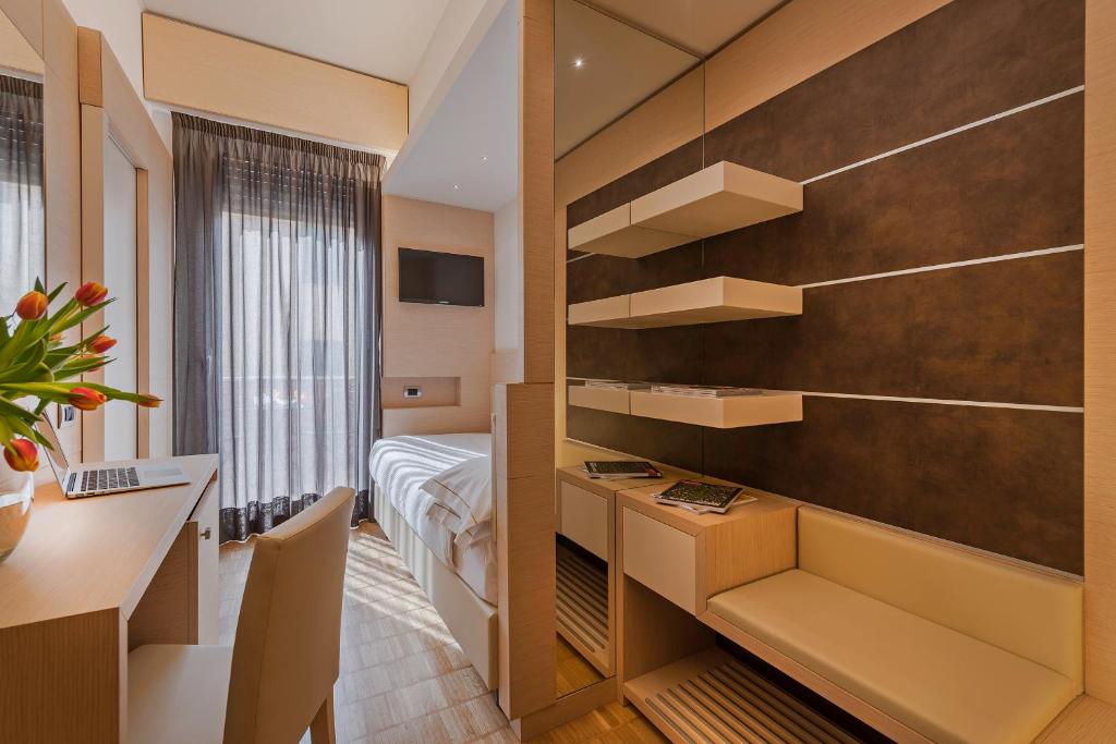 Postel nebo postele na pokoji v ubytování Hotel Ariston
