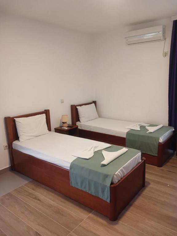 Postel nebo postele na pokoji v ubytování Hotel Denis