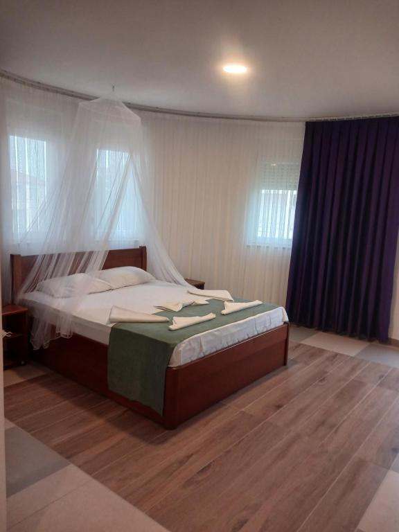 Postel nebo postele na pokoji v ubytování Hotel Denis