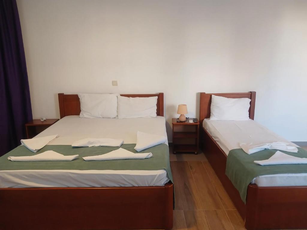 Postel nebo postele na pokoji v ubytování Hotel Denis