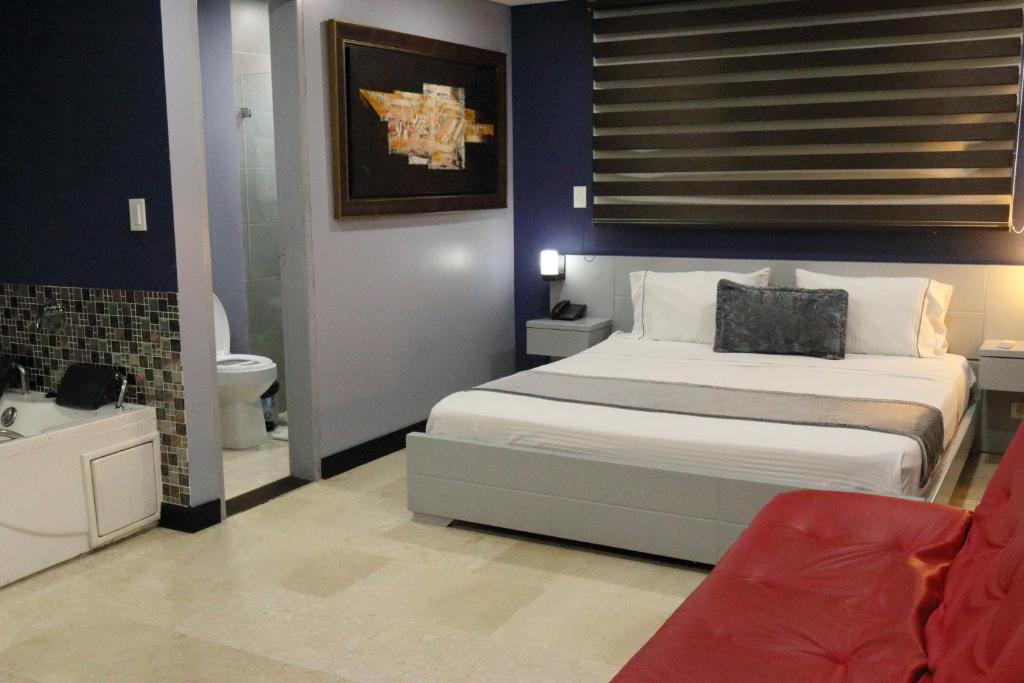 Postel nebo postele na pokoji v ubytování Hotel Lleras 10