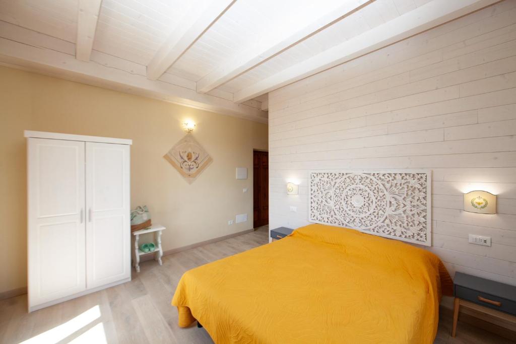 Una cama o camas en una habitación de Villa le Api