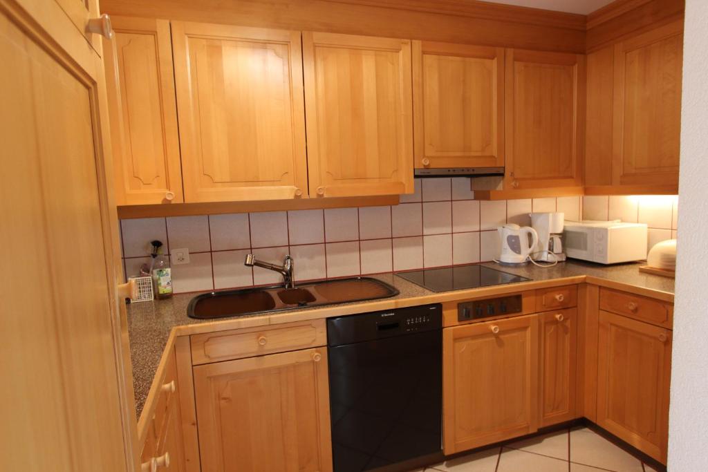 Kuchyň nebo kuchyňský kout v ubytování Forêt C13