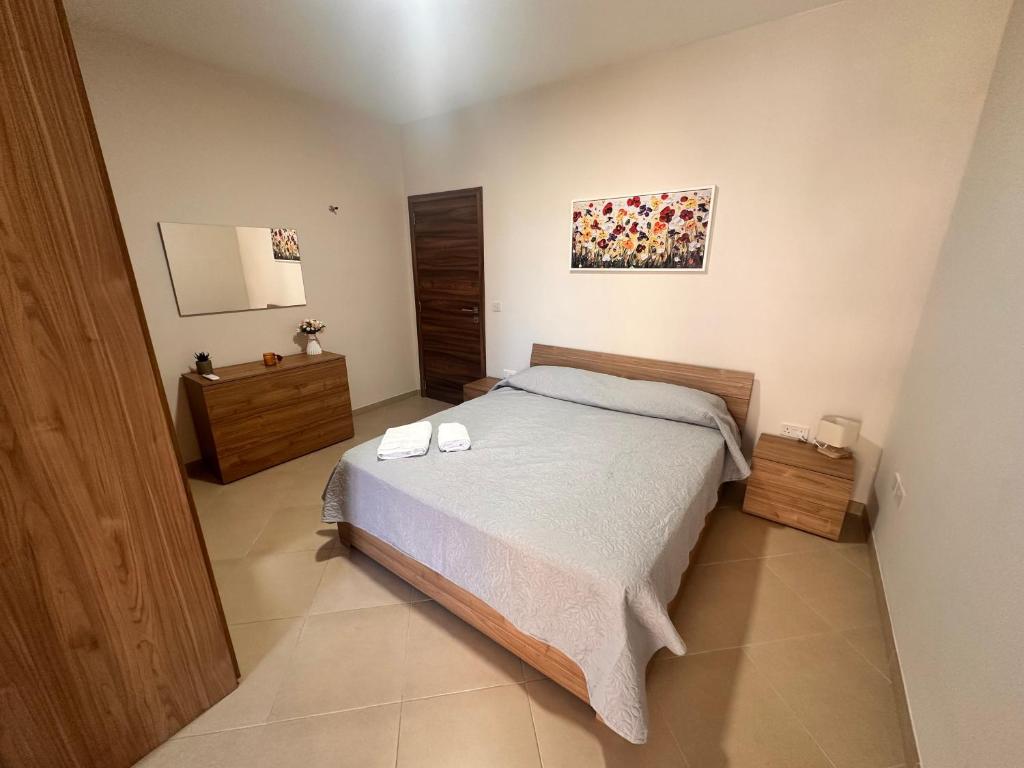 Voodi või voodid majutusasutuse Cliff Side Apartment toas