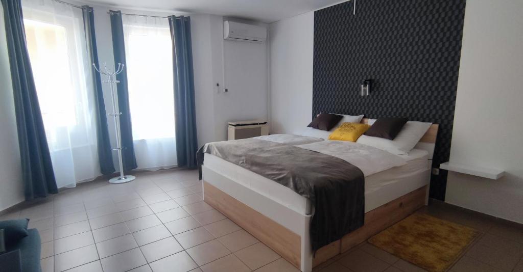 Postel nebo postele na pokoji v ubytování Nova Suites