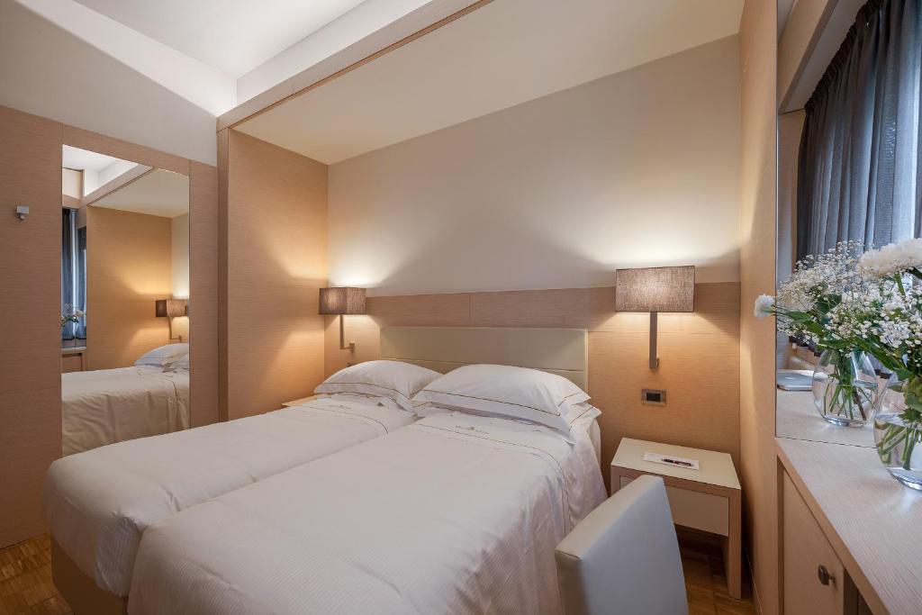 Postel nebo postele na pokoji v ubytování Hotel Ariston