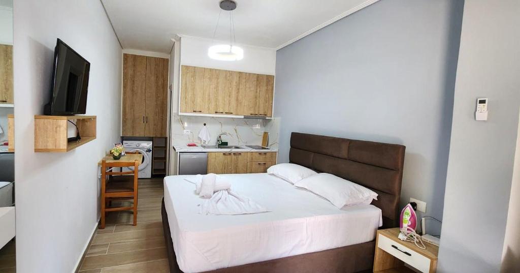 Postel nebo postele na pokoji v ubytování RIAN GUEST HOUSE