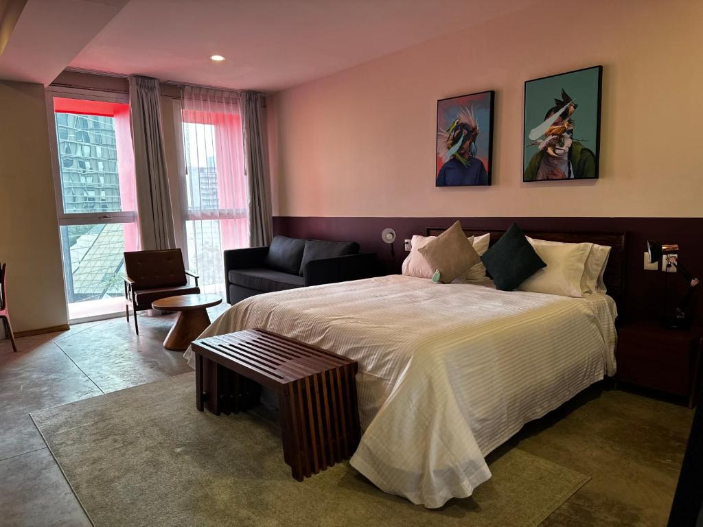 Postel nebo postele na pokoji v ubytování Hotel Olá Chapultepec