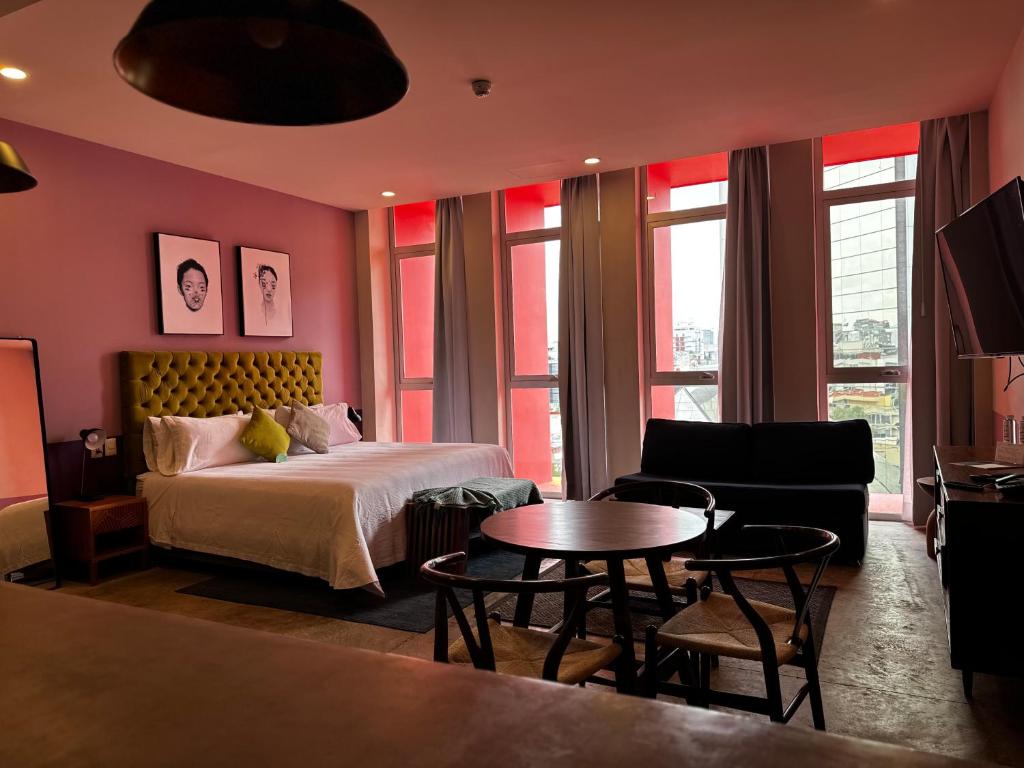 Postel nebo postele na pokoji v ubytování Hotel Olá Chapultepec