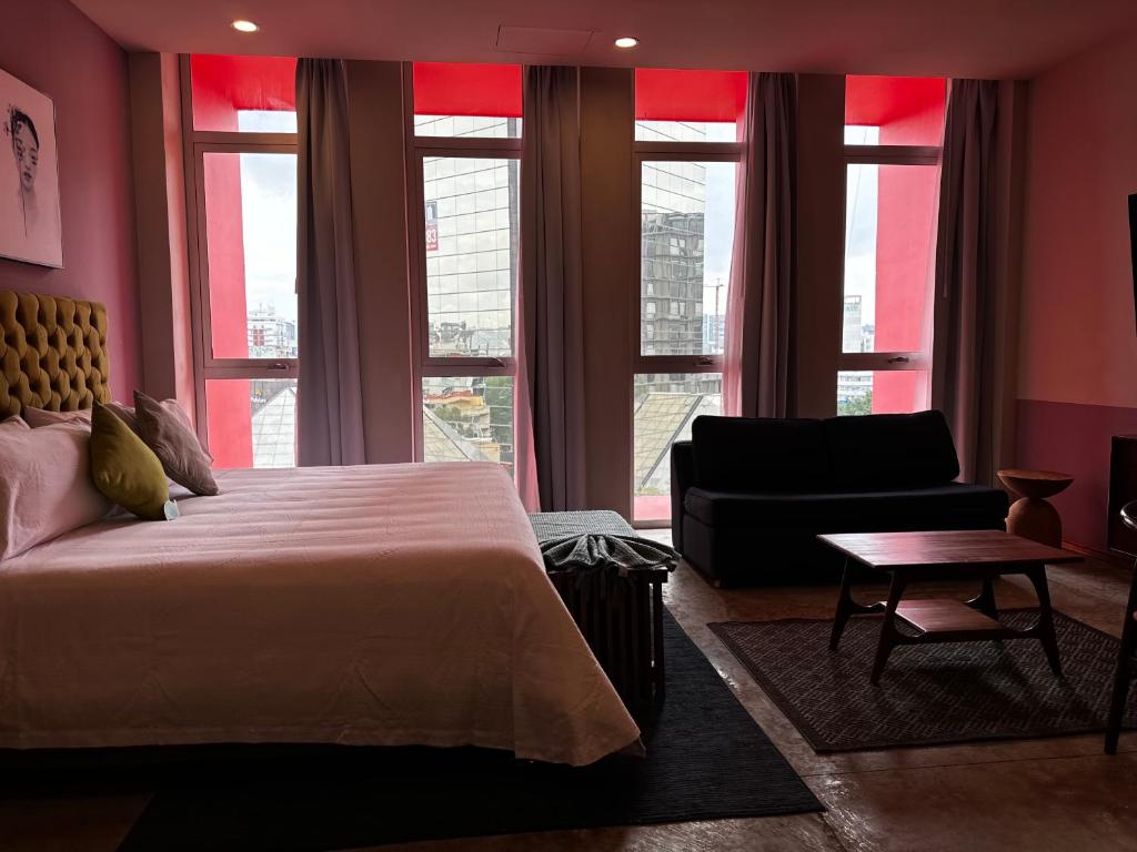 Postel nebo postele na pokoji v ubytování Hotel Olá Chapultepec