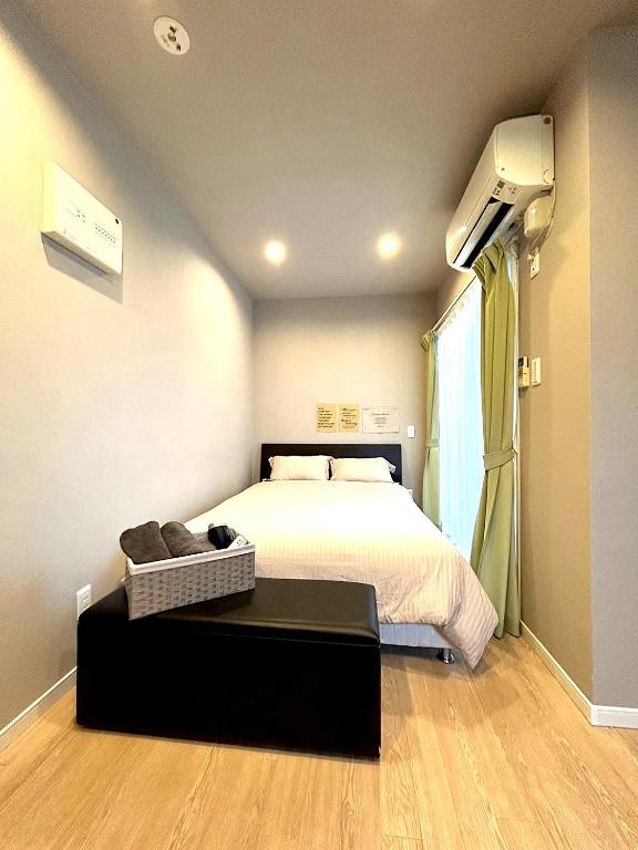 Postel nebo postele na pokoji v ubytování KIYAZA Resort 沖縄 EAST