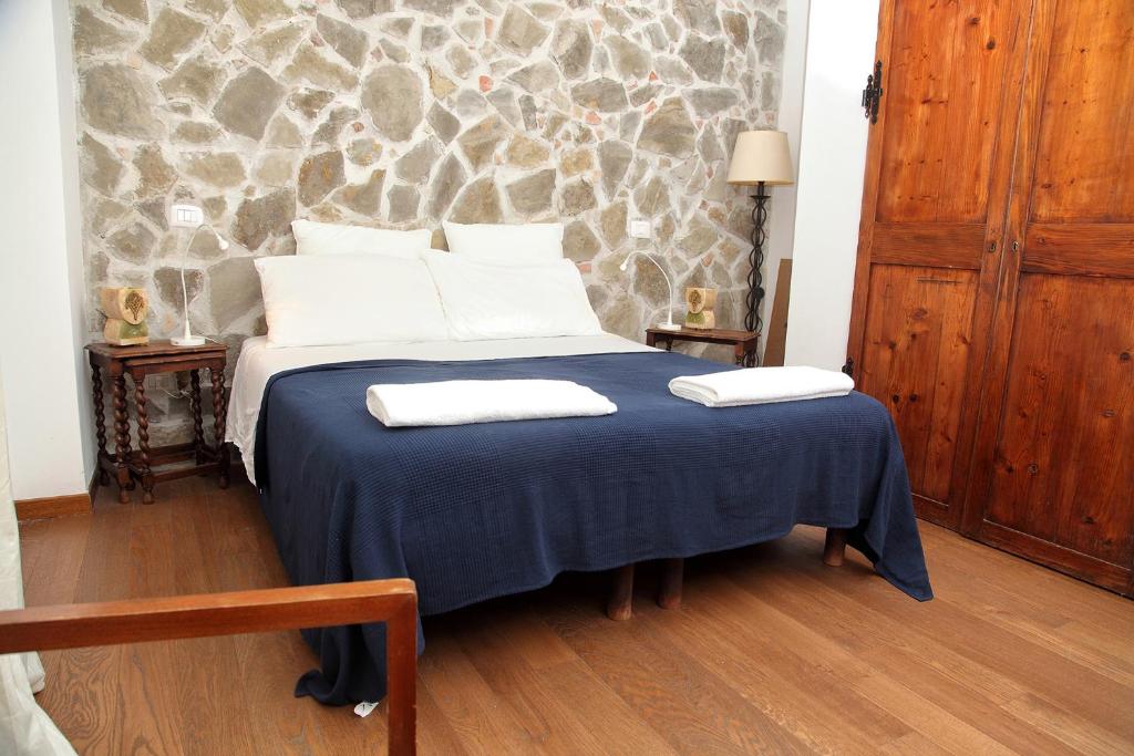 Postel nebo postele na pokoji v ubytování Torre Di Sebastiano