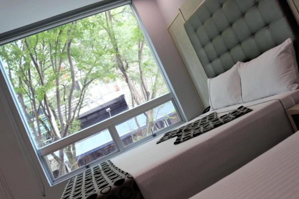 Postel nebo postele na pokoji v ubytování Hotel Lleras Express