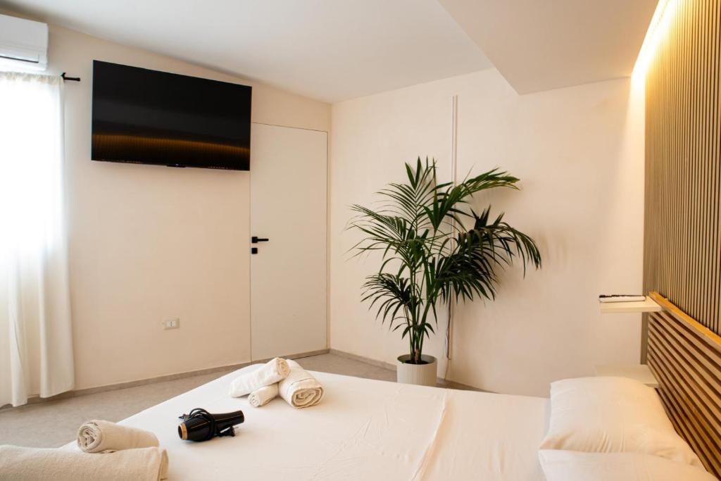 Postel nebo postele na pokoji v ubytování Suites Mediterranèè