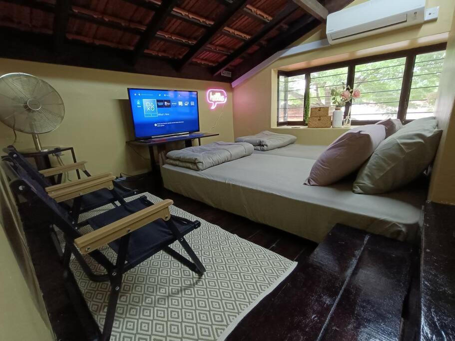 a bedroom with a large bed and a television at The Syawal ya Fattah ya Razzaq in Johor Bahru