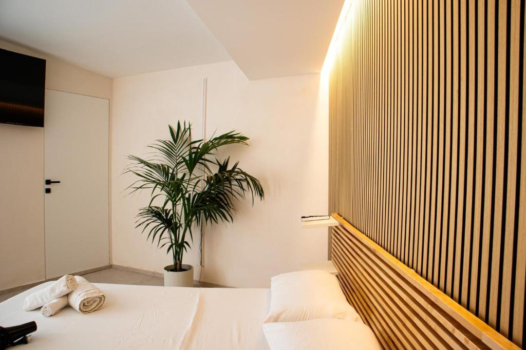 Postel nebo postele na pokoji v ubytování Suites Mediterranèè